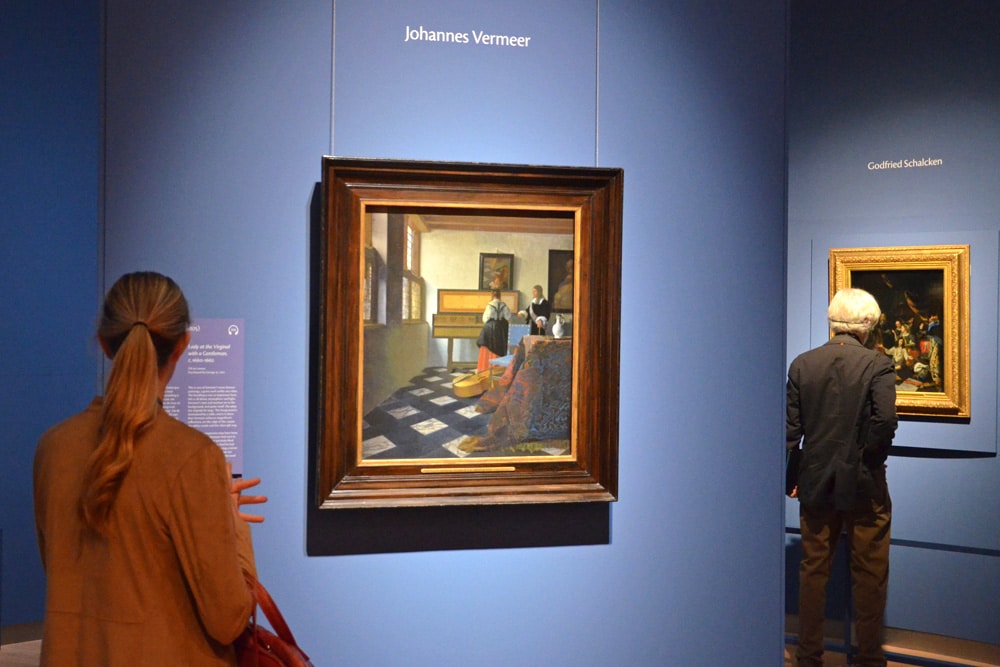 Bezoekers bij Vermeers Dame aan het virginaal met een heer (‘De muziekles’)